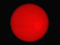 Photo of Sun
      disk through a small optical tube