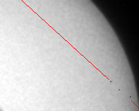black and white photo of
      a quarter of sun disk with a 3 points show the path of Mercury
