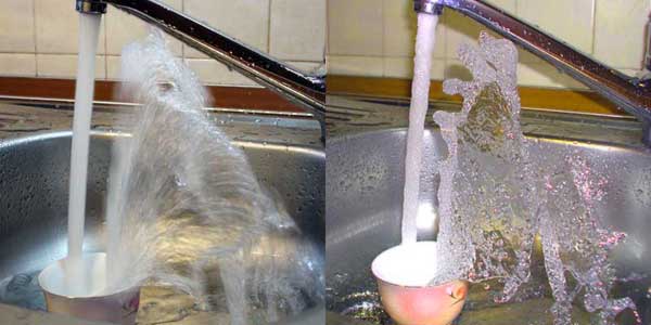 Water from a faucet is pouring
      into a cup. The photo with a flash shows details.